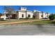 Attractive community building with manicured landscaping and well-maintained sidewalks at 2611 Shantiniketan Blvd # G-11, Tavares, FL 32778