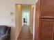Bright hallway with tiled floors connecting the kitchen to other rooms at 2611 Shantiniketan Blvd # G-11, Tavares, FL 32778
