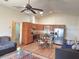 Open-concept kitchen featuring stainless steel appliances and an eat-in dining area at 2611 Shantiniketan Blvd # G-11, Tavares, FL 32778