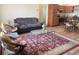 Open-concept living room featuring hardwood floors and plenty of natural light at 2611 Shantiniketan Blvd # G-11, Tavares, FL 32778