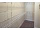 Walk-in closet featuring built-in wire shelving at 2611 Shantiniketan Blvd # G-11, Tavares, FL 32778