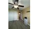 Bedroom features hardwood floors, closet, and a ceiling fan at 2667 River Landing Dr, Sanford, FL 32771