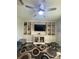 Comfortable living room features a ceiling fan, modern shelving, and media center at 2667 River Landing Dr, Sanford, FL 32771