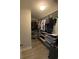 Organized walk-in closet features shelves and hanging racks for ample clothing and storage space at 2667 River Landing Dr, Sanford, FL 32771