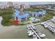 Picturesque waterfront condo community featuring a marina, pool, and lush landscaping at 2700 N Peninsula Ave # 314, New Smyrna Beach, FL 32169