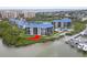 Beautiful aerial view of condo buildings with waterfront access and community pool at 2700 N Peninsula Ave # 314, New Smyrna Beach, FL 32169
