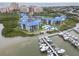 Picturesque waterfront condo community featuring a marina, pool, and lush landscaping at 2700 N Peninsula Ave # 314, New Smyrna Beach, FL 32169