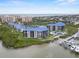 Scenic aerial view of condo complex with pool, pier and water access, showcasing the coastal lifestyle at 2700 N Peninsula Ave # 314, New Smyrna Beach, FL 32169