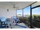 Relaxing screened balcony with comfortable seating and marina views at 2700 N Peninsula Ave # 314, New Smyrna Beach, FL 32169