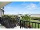 View of the marina from the balcony, complete with lush greenery and railings at 2700 N Peninsula Ave # 314, New Smyrna Beach, FL 32169