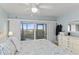 Tranquil bedroom with balcony access and dresser at 2700 N Peninsula Ave # 314, New Smyrna Beach, FL 32169