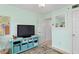 Bedroom showcasing entertainment center with a tv and comfortable carpet creating a cozy space at 2700 N Peninsula Ave # 314, New Smyrna Beach, FL 32169