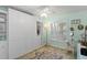 This bedroom features custom wardrobe, a cozy rug, natural light and a desk area offering a tranquil retreat at 2700 N Peninsula Ave # 314, New Smyrna Beach, FL 32169