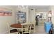 Dining area with adjacent kitchen, perfect for entertaining at 2700 N Peninsula Ave # 314, New Smyrna Beach, FL 32169