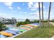 Kayak storage on the waterfront with palm trees, manicured lawn, and convenient access to boating at 2700 N Peninsula Ave # 314, New Smyrna Beach, FL 32169