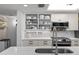 Updated kitchen featuring quartz countertops, modern appliances, and white cabinetry, perfect for any home chef at 2700 N Peninsula Ave # 314, New Smyrna Beach, FL 32169