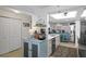 Open kitchen with stainless steel appliances and custom cabinets, creating a functional and stylish cooking area at 2700 N Peninsula Ave # 314, New Smyrna Beach, FL 32169