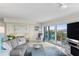 Open living room with sliding glass doors to balcony and water views at 2700 N Peninsula Ave # 314, New Smyrna Beach, FL 32169