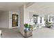 Welcoming condo lobby with seating, plants, and unit doors, providing a comfortable entrance at 2700 N Peninsula Ave # 314, New Smyrna Beach, FL 32169