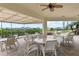 Inviting outdoor seating area with ceiling fans, tables, and chairs, overlooking the boats at the marina and the waterfront at 2700 N Peninsula Ave # 314, New Smyrna Beach, FL 32169
