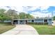 Charming one-story home with a well-manicured lawn and inviting curb appeal at 2707 Prince John Rd, Winter Park, FL 32792