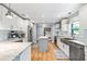 Spacious kitchen with stainless steel appliances, white cabinets, and a central island at 2707 Prince John Rd, Winter Park, FL 32792