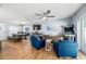 Comfortable living room with hardwood floors, a ceiling fan, and entertainment features at 2707 Prince John Rd, Winter Park, FL 32792