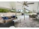 Relaxing covered patio with modern furnishings and a view of the inviting pool at 2707 Prince John Rd, Winter Park, FL 32792