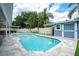 Inviting backyard pool featuring ample patio space, landscaping, and a storage shed at 2707 Prince John Rd, Winter Park, FL 32792