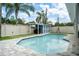 Sparkling pool with a putting green and storage shed in the backyard at 2707 Prince John Rd, Winter Park, FL 32792