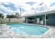 Inviting backyard pool with a hot tub and outdoor kitchen area at 2707 Prince John Rd, Winter Park, FL 32792