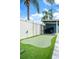 Backyard putting green for golf enthusiasts, next to a storage shed at 2707 Prince John Rd, Winter Park, FL 32792