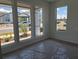 Bright bedroom featuring multiple windows providing ample natural light and neutral carpet at 2976 Embark Trail, St Cloud, FL 34771