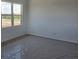 Bright, carpeted bedroom with a window offering outdoor views at 2976 Embark Trail, St Cloud, FL 34771