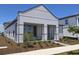 Modern home featuring professionally landscaped yard and unique front architecture at 2976 Embark Trail, St Cloud, FL 34771