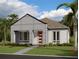 Charming single-story home with modern design, manicured lawn, and mature palm trees at 2976 Embark Trail, St Cloud, FL 34771