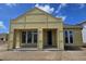 New construction home featuring large windows, covered porch, and modern architectural details at 2976 Embark Trail, St Cloud, FL 34771