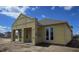 New construction home featuring large windows, covered porch, and modern architectural details at 2976 Embark Trail, St Cloud, FL 34771