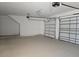 Spacious two car garage with white walls and ceiling at 2976 Embark Trail, St Cloud, FL 34771