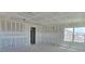 Spacious living room featuring unfinished drywall and natural light at 2976 Embark Trail, St Cloud, FL 34771