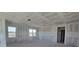 Bright living room with large windows and unfinished drywall at 2976 Embark Trail, St Cloud, FL 34771