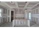 Spacious living room showcasing unfinished drywall, recessed lighting, and open floor plan at 2976 Embark Trail, St Cloud, FL 34771
