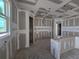 Spacious living room showcasing unfinished drywall, recessed lighting, and open floor plan at 2976 Embark Trail, St Cloud, FL 34771