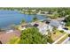 Stunning aerial view of lakeside homes, serene water, and mature trees in a quiet neighborhood at 318 Osprey Lakes Cir, Chuluota, FL 32766