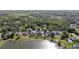 Community aerial shot featuring a large lake, well-maintained lawns, and scenic neighborhood streets at 318 Osprey Lakes Cir, Chuluota, FL 32766