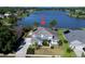 Aerial view of the beautiful home with a picturesque lake in the backyard at 318 Osprey Lakes Cir, Chuluota, FL 32766