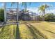 Backyard with screened enclosure at 318 Osprey Lakes Cir, Chuluota, FL 32766