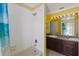 Bathroom with shower/tub combination and double sink vanity at 318 Osprey Lakes Cir, Chuluota, FL 32766