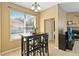 Cozy dining area with bright natural light and a fireplace in the next room at 318 Osprey Lakes Cir, Chuluota, FL 32766
