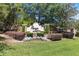 Well maintained Osprey Lakes entrance surrounded by manicured landscaping and mature trees at 318 Osprey Lakes Cir, Chuluota, FL 32766